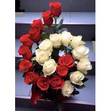 Floral arrangement of red and white roses in a spiral